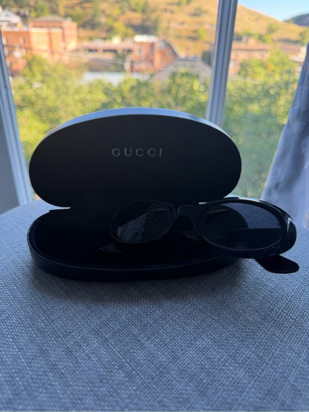 Gucci Black Oval Sunglasses with Branded Case